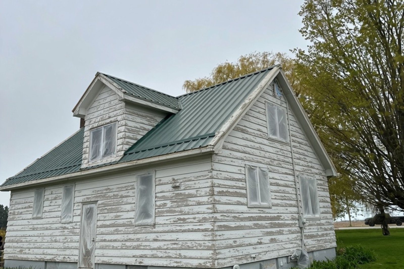 Farmhouse exterior before painting